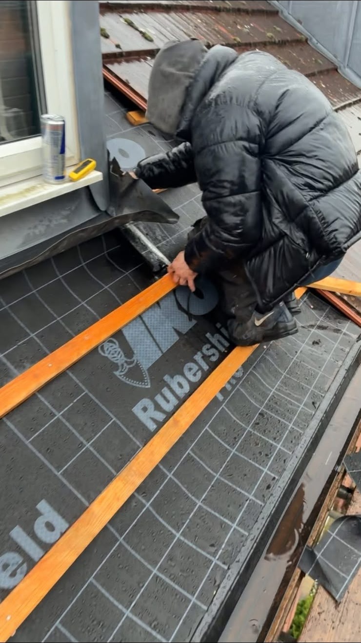 Flat roof installation Glasgow: timber trims fixed over a new flat roof membrane