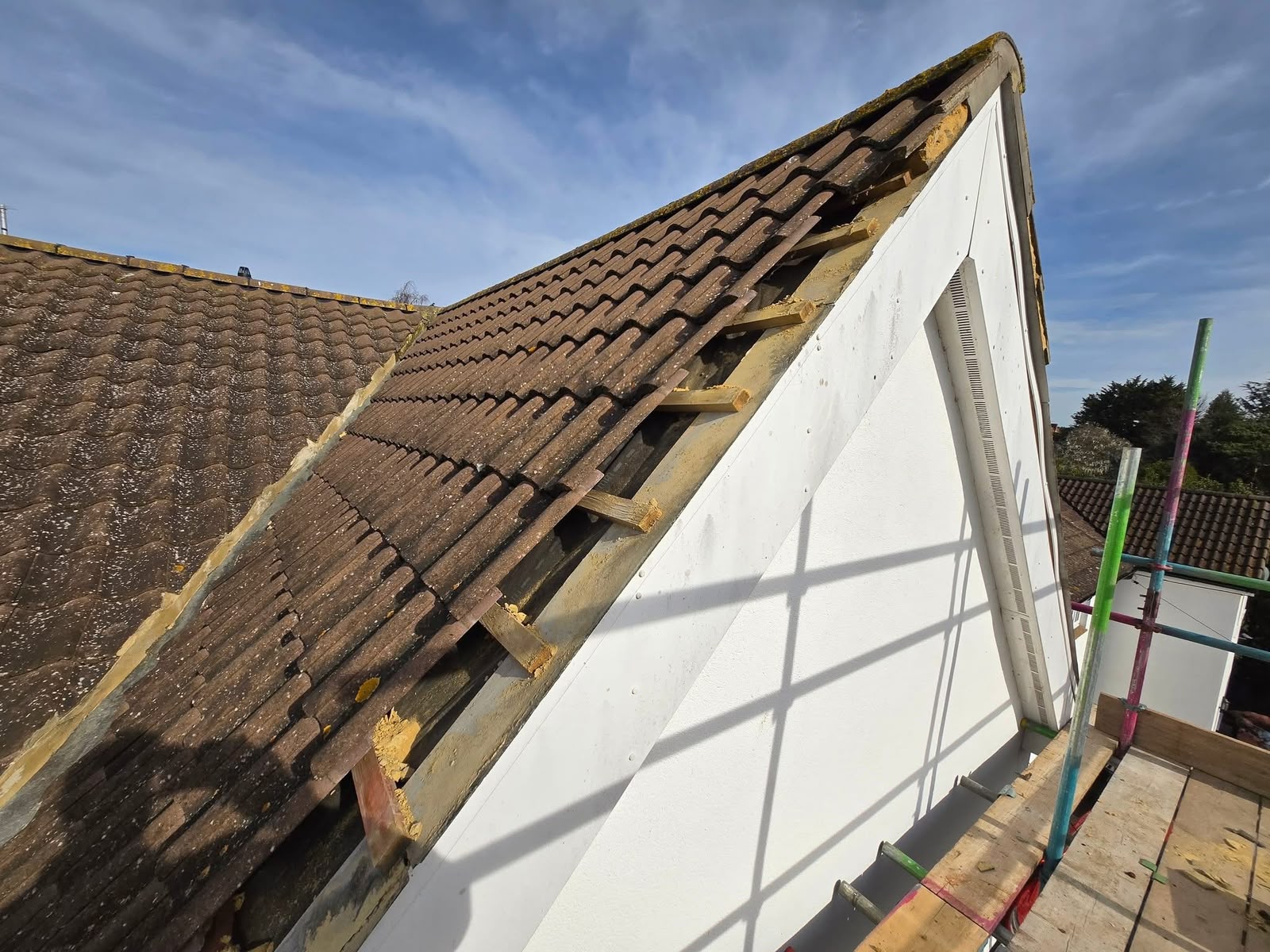 uPVC roofline Glasgow: new white bargeboard fitted along a gable