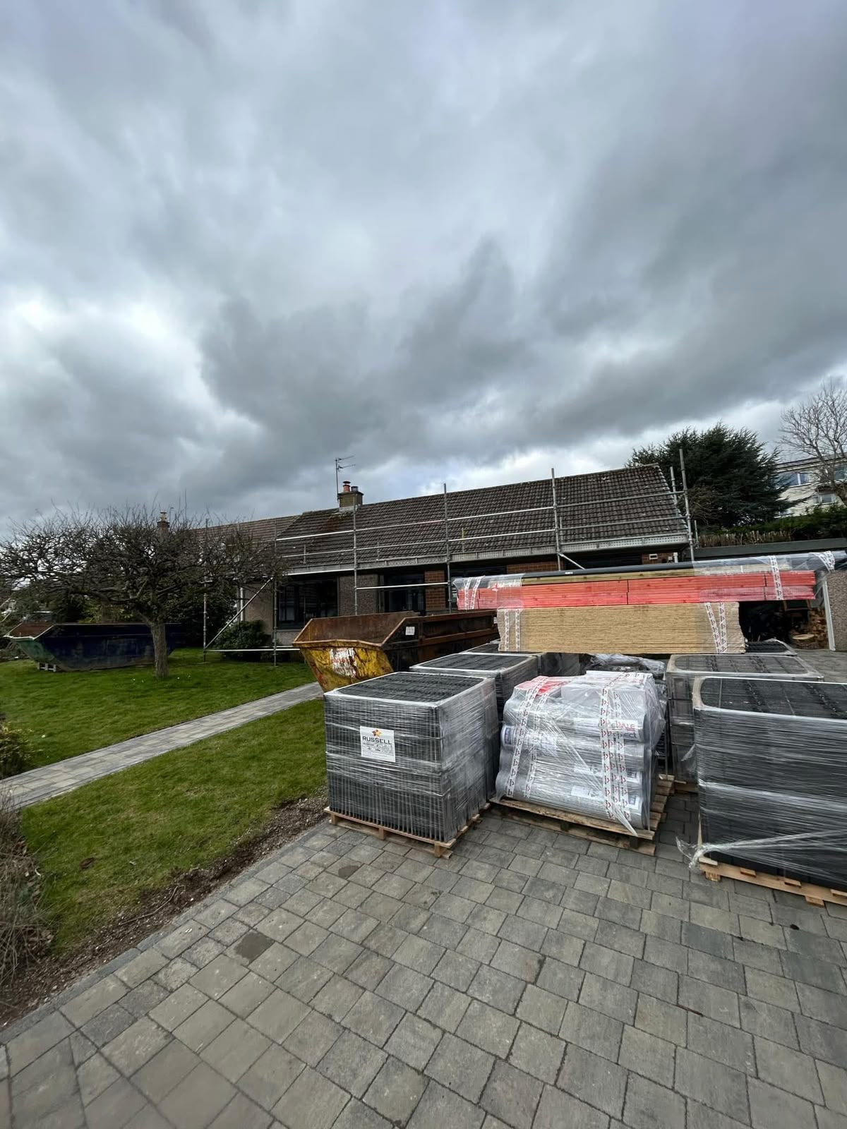 Roofing Glasgow: pallets of new roof tiles delivered to a Monarch Roofing job